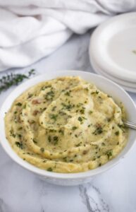 These Dairy Free Roasted Garlic Mashed Potatoes are a healthy vegan mashed potato recipe packed with flavor. They are a great plant-based holiday side dish or cozy everyday dinner side. Instead of butter, they use a creamy roasted garlic sauce made with silken tofu that adds extra protein without a ton of fat!