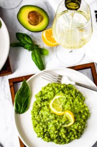 This Avocado Pesto Barley Risotto is an easy, quick, and vegan take on classic risotto that is perfect for summer! Tender cooked barley is drenched in a creamy dairy-free avocado sauce bursting with fresh herbs like basil and brightened up with a healthy squeeze of lemon juice. This is the perfect fresh and healthy plant-based lunch or dinner and is easily made oil-free! Serve this easy vegan risotto with our lemon pepper tofu cutlets for a full meal.
