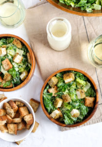 This easy vegan caesar salad recipe is delicious, nut-free, and meal prep friendly! The dressing is made with a silken tofu base and flavored to perfection with only 9 simple ingredients. #vegan #caesarsalad #veganrecipe #mealprep #salad // plantpowercouple.com