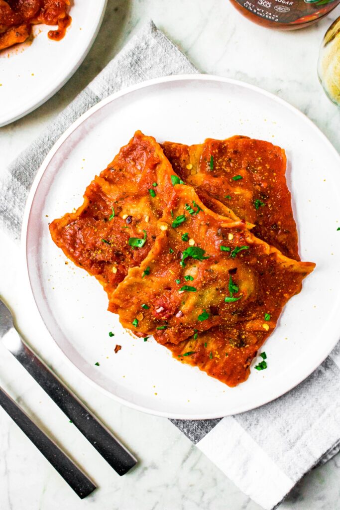 This healthy homemade vegan ravioli recipe is a fun cooking project, and you’ll probably be surprised how easy it actually is! Filled with a spicy Italian-inspired quinoa meat and dairy free spinach ricotta cheese filling, they are FULL of flavor and the perfect plant based comfort food.