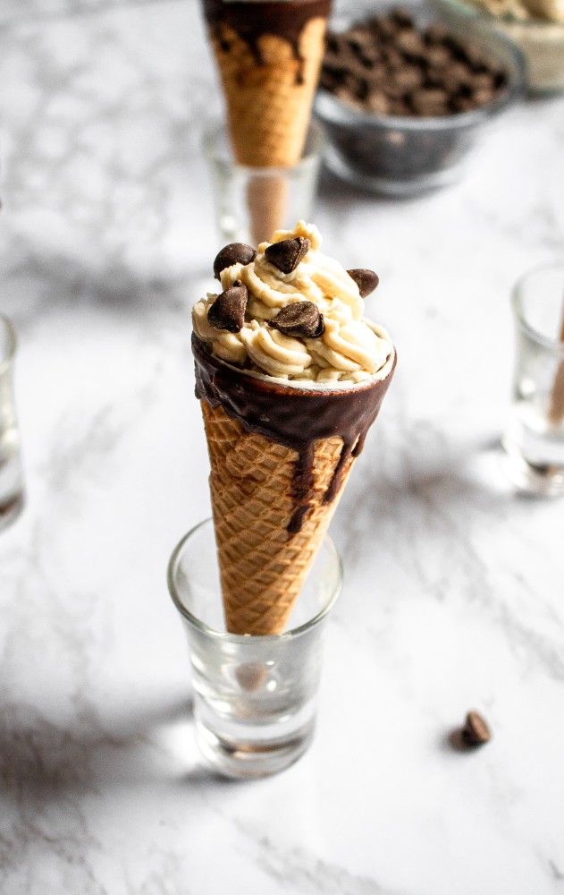 These Vegan Cannoli Cones, infused with decadent white chocolate flavor, are a fun and delicious dairy-free dessert. They’re easy to make, requiring only 8 ingredients! #vegandessert #dairyfree #dessert #cannoli #cocoabutter #tofu #tofurecipe #veganchocolate // plantpowercouple.com