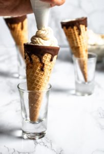 These Vegan Cannoli Cones, infused with decadent white chocolate flavor, are a fun and delicious dairy-free dessert. They’re easy to make, requiring only 8 ingredients! #vegandessert #dairyfree #dessert #cannoli #cocoabutter #tofu #tofurecipe #veganchocolate // plantpowercouple.com