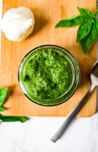 This vegan pesto recipe is easy to make with flavorful ingredients like cashews, nutritional yeast, and miso paste for a cheesy fermented taste. This plant-based pesto is perfect for vegan pesto pasta, a pesto pizza, and served as a dip or spread on a dairy-free snack board. It can be made with spinach, basil, or a combination of the two which makes this the perfect recipe for any time of year. You’ll be shocked how easy it is to make your own homemade pesto!