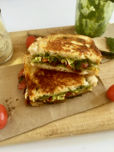 This vegan caprese grilled cheese sandwich is the epitome of summertime greatness! Flavor-packed pesto, balsamic tomato jam, and our favorite fresh vegan mozzarella all wrapped in the loving arms of two pieces of garlic bread - HELLO, HEAVEN! // Recipe: plantpowercouple.com