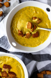 Friends, meet our new favorite winter weeknight meal: Cheesy Broccoli Blender Soup! We're kind of obsessed with it right now and think you will be too. It's comforting, flavorful, easy to make, and so chock-full of sneaky, hidden veggies, it will make your head spin. #vegan #oilfree #soup #vitamix // plantpowercouple.com
