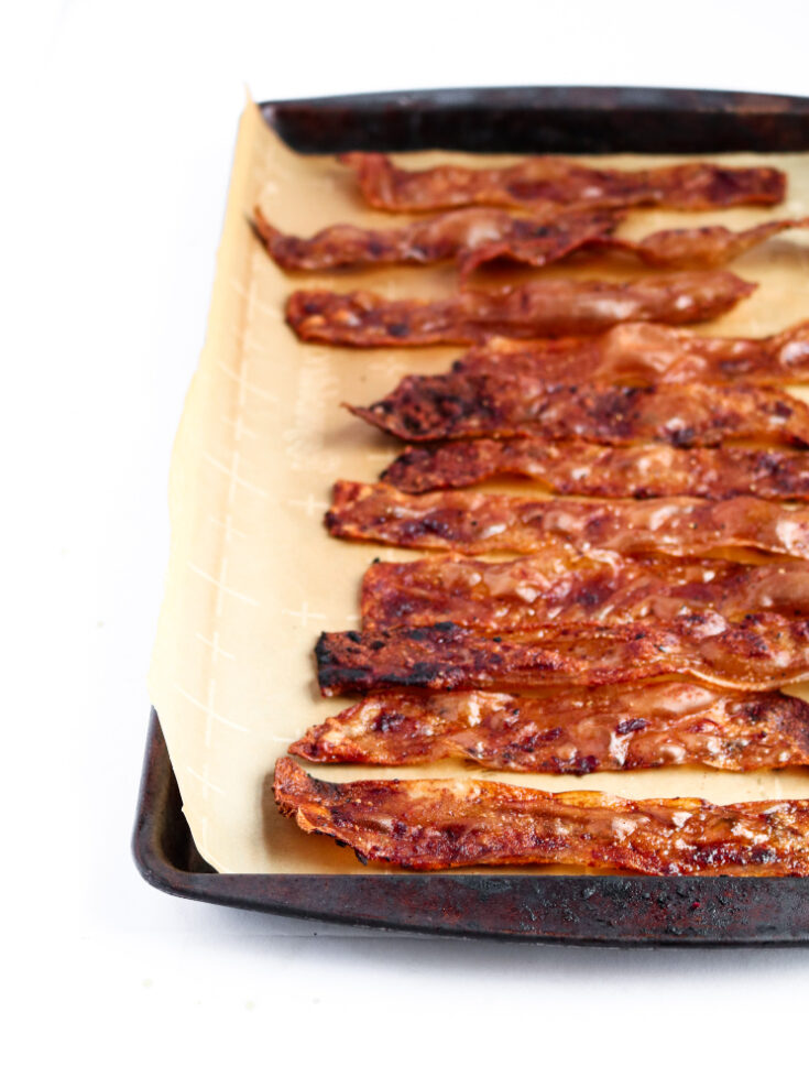 This rice paper bacon is so easy and fun to make! It requires simple pantry ingredients you can keep on hand for whenever that smoky-salty-sweet craving strikes. It can easily be made gluten-free and tastes shockingly like the bacon we grew up eating! #vegan #bacon #veganrecipes // plantpowercouple.com