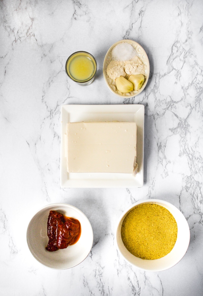 Overhead photo of all the ingredients you need to make vegan queso out of silken tofu