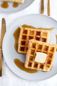 Easy, ten-ingredient, freezer-friendly and toaster-friendly homemade vegan waffles. Simple enough for the beginner cook to dazzle and the perfect addition to a Sunday brunch… or a Thursday dinner! #vegan #waffles #dairyfree #breakfast // plantpowercouple.com