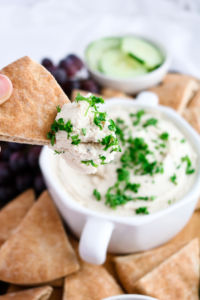This vegan tahini feta dip is quick, uncomplicated, mind-blowingly flavorful, and the perfect spring appetizer. All you need is a food processor, 10 minutes, and 11 simple ingredients.﻿ #vegan #plantbased #appetizer #dip #tofu // plantpowercouple.com