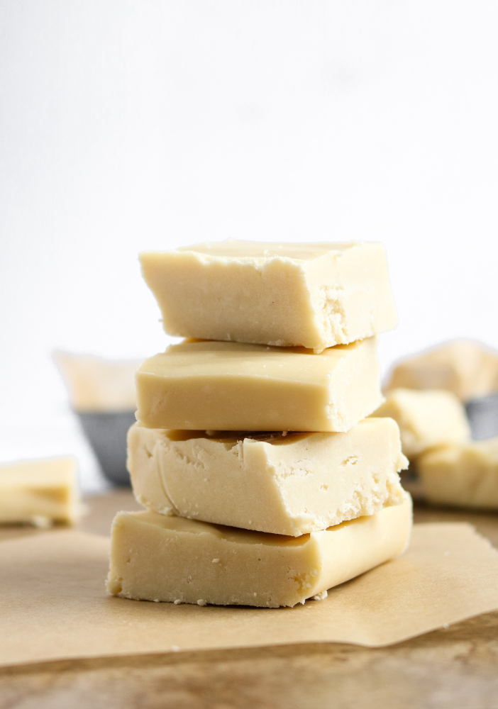 This 6-ingredient Vegan White Chocolate Fudge is the dessert of your summer dreams! It’s decadent and delicious, takes about 15 minutes of active time to make + even includes a  low(er) sugar trick we love. #vegan #dairyfree #fudge #whitechocolate #veganchocolate // plantpowercouple.com