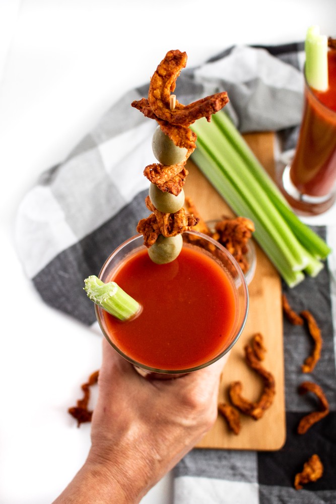 This meaty vegan jerky is made in the air fryer and full of that classic Bloody Mary cocktail flavor. The perfect snack to enjoy with a cold beer! #vegan #plantbased #jerky #recipe // plantpowercouple.com