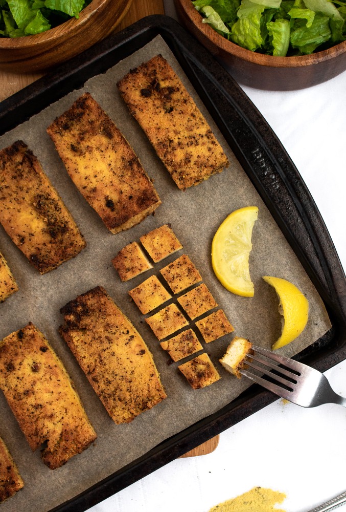 Lemon Pepper Tofu Cutlets are the perfect meal prep staple! Slice ‘em up for salads, use them for sandwiches, or serve ‘em over a mountain of rice for a filling and easy vegan dinner! #vegan #tofu #veganrecipe #plantbased #mealprep // plantpowercouple.com