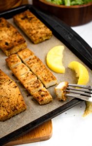 Lemon Pepper Tofu Cutlets are the perfect meal prep staple! Slice ‘em up for salads, use them for sandwiches, or serve ‘em over a mountain of rice for a filling and easy vegan dinner! #vegan #tofu #veganrecipe #plantbased #mealprep // plantpowercouple.com