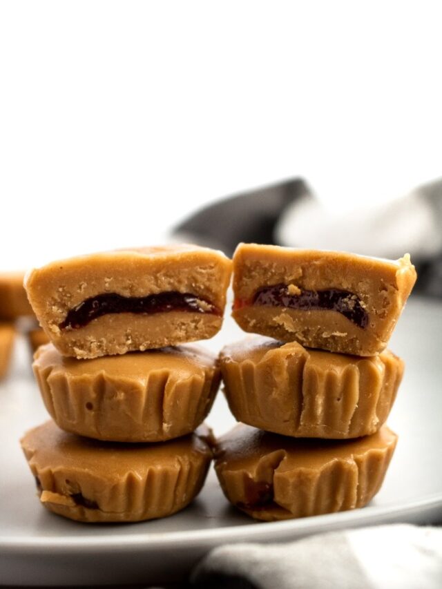 PB + J meets peanut butter cup in this killer combo of classic comfort foods! These delightful PB+J Cups are easy to make with only 4 ingredients, simple methods, and no heat required. They’re the ultimate summer sweet for your kids or the kid in us all! #vegan #dairyfree #vegancandy #veganrecipes #glutenfree //plantpowercouple.com