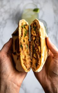 This vegan crunchwrap is delicious, easy, and just plain FUN. It makes an awesome vegan dinner or lunch recipe that can be prepared ahead of time and totally customized to your tastes. #vegan #crunchwrap #plantbased #plantpowercouple // plantpowercouple.com