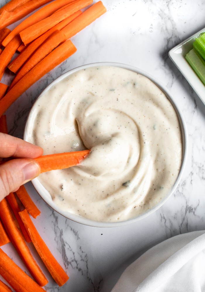 The vegan ranch dip takes 10 minutes, 1 bowl, and 9 staple ingredients. It’s gluten-free, picky-eater-friendly, and makes a terrific quick + easy party appetizer! #vegan #ranch #plantpowercouple #veganappetizer // plantpowercouple.com