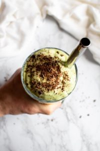 Your favorite childhood St Patrick’s Day treat is now vegan and chock-full of booze thanks to this Boozy Vegan Shamrock Shake recipe! It’s easy to make with a thick indulgent texture that will leave you SHOCKED there’s no dairy in it. #vegan #veganmilkshake #saintpatricksday #avocado #mint #mintchocolatechip #plantbased