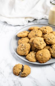 These are the BEST vegan chocolate chip cookies. The recipe is easy to make with simple ingredients, using applesauce instead of eggs for a healthy swap. These chewy vegan cookies taste just like the ones you grew up making! #vegan #vegancookies #vegandessert #vegandessertrecipe #chocolatechipcookies #eggfree #dairyfree #chocolate #veganchocolate #vegan #veganbaking #holidaybaking
