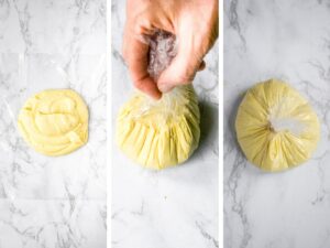 The three steps to shaping a vegan cheese ball: plop the dairy free cheese mixture on a sheet of plastic wrap, pull up on the edges of the wrap, and tie it with a rubber band to form a ball.