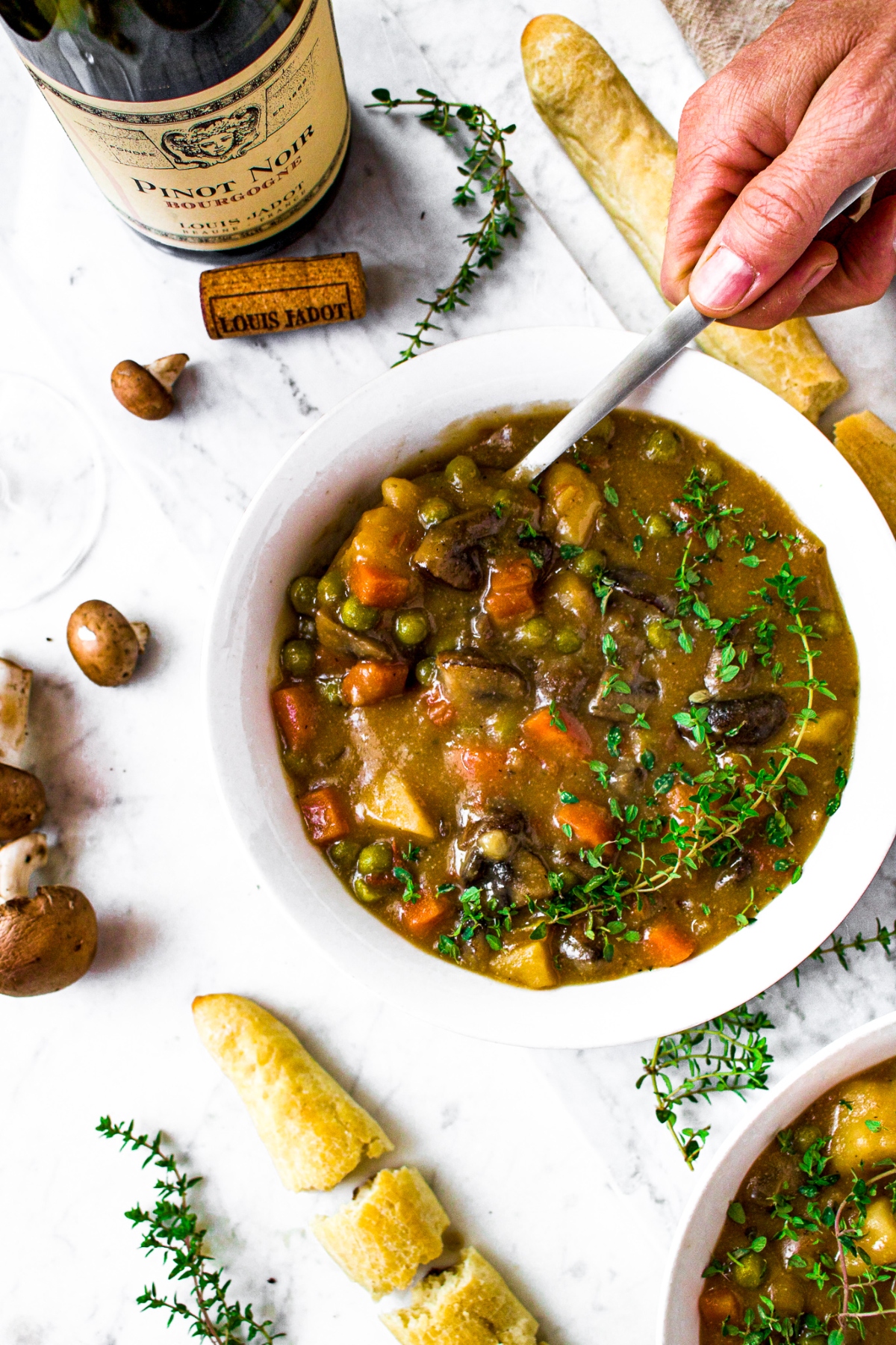 This hearty, vegan mushroom stew recipe is easy to make and sure to please! Packed with root vegetables, earthy herbs, and meaty mushrooms swimming in a thick, velvety broth, this may quickly become your new favorite vegetarian winter dinner!