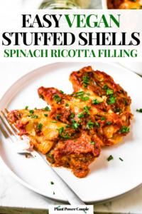Three vegan stuffed jumbo shells on a round plate sprinkled with fresh green herbs. Text reads: easy vegan stuffed shells, spinach ricotta filling