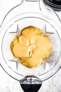 Overhead shot of a Vitamix filled with a creamy peanut butter pie filling