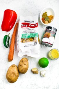 Overhead photo of all the ingredients you need to make slow cooker vegan curry with soy curl chicken