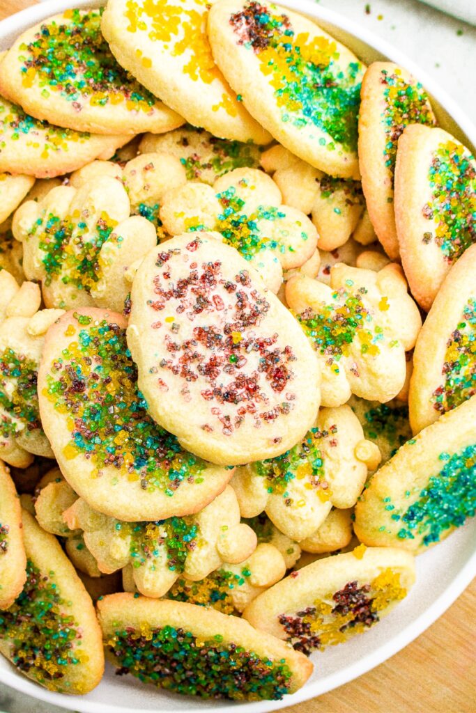 Zoomed in photo of a pile of dairy-free spritz cookies decorated like Easter eggs