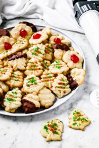 Overhead photo of a large plate of vegan butter cookies decorated for Christmas