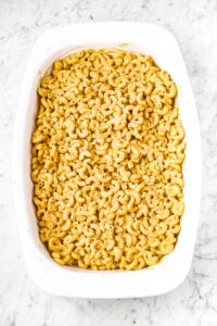 overhead photo of a casserole dish of vegan mac and cheese