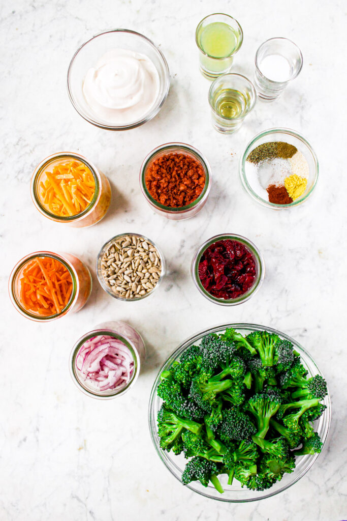 Overhead photo of all the ingredients you need to make vegan broccoli slaw salad