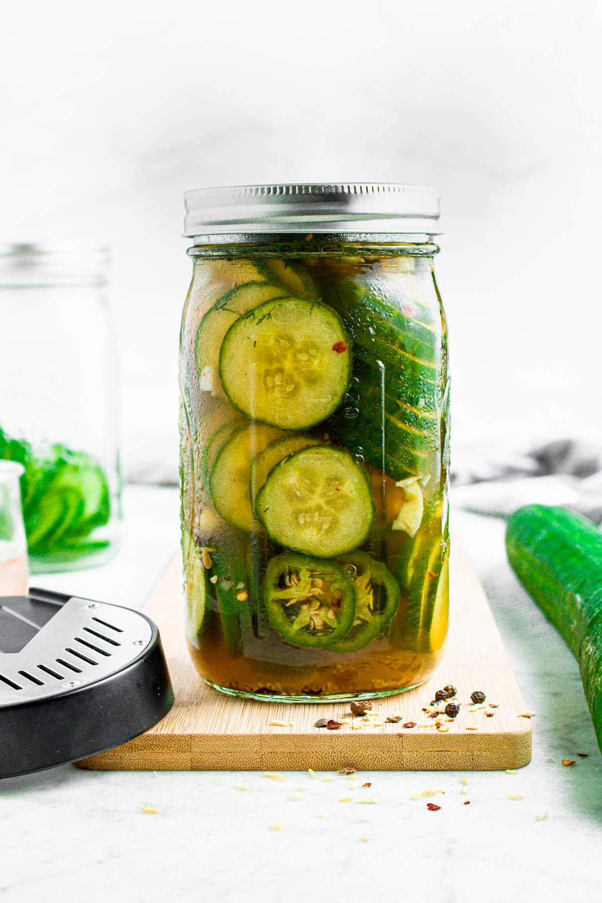 Head-on photo of a jar of bourbon maple refrigerator pickles