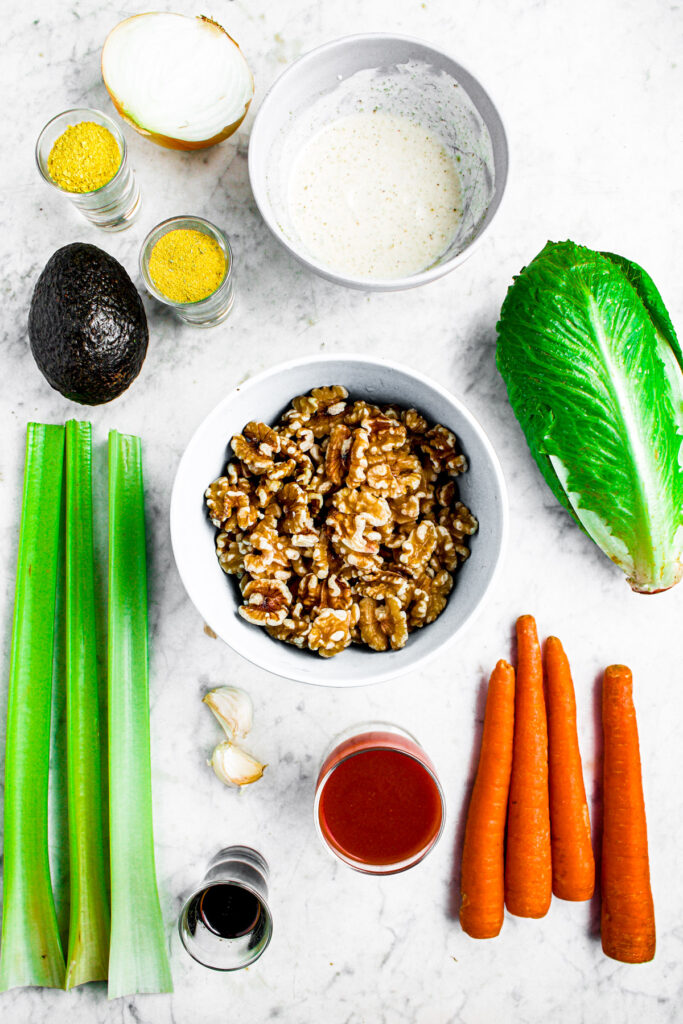Overhead photo of all the ingredients you need to make vegan buffalo lettuce wraps with walnuts
