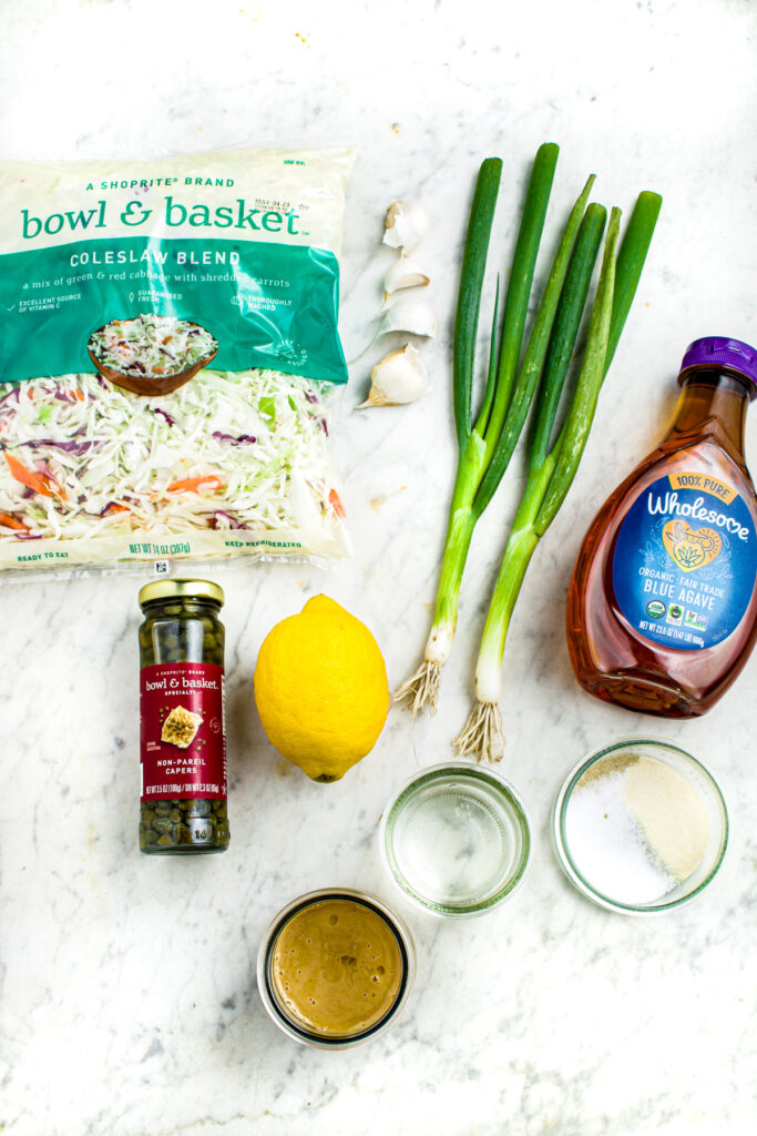 Overhead photo of all the ingredients you need to make lemon tahini slaw
