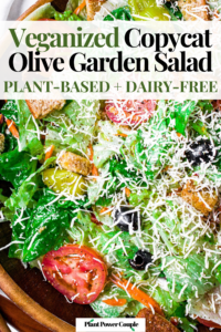 Overhead zoomed in photo of a big green Italian salad with pepperoncini, black olives, tomatoes, croutons, and dairy-free parmesan. Text reads: veganized copycat olive garden salad, plant-based and dairy-free