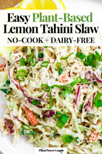 Overhead close up photo of a pile of creamy tahini cabbage slaw topped with freshly ground black pepper. Text reads: easy plant-based lemon tahini slaw, no-cook and dairy-free