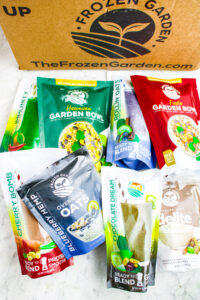 Overhead photo of a pile of Frozen Garden products next to a Frozen Garden box