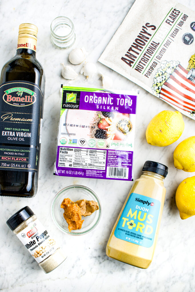 Overhead view of all the ingredients you need to make creamy lemon vinaigrette with silken tofu