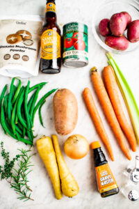 Overhead view of all the ingredients you need to make a stew with vegetables