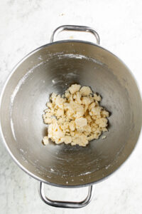 Overhead view of creamed vegan butter and sugar in a mixing bowl